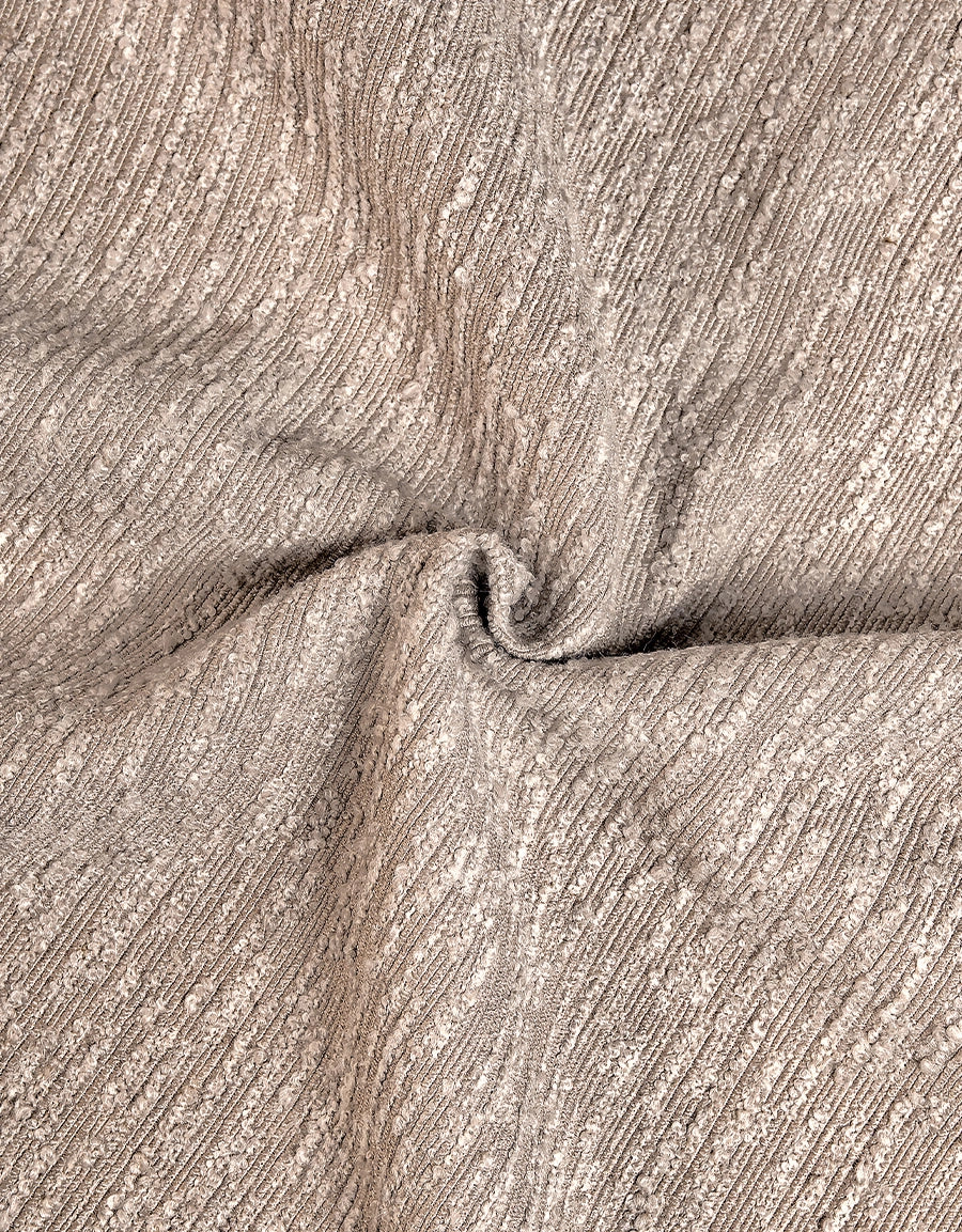 Närbild boucletyg, taupe